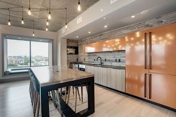 A large kitchen with a large island and stainless steel appliances
