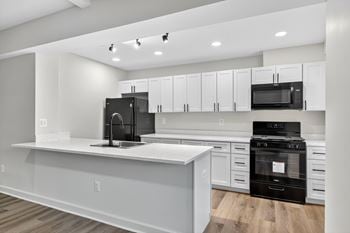 Renovated apartments available with black appliances and modern black hardware