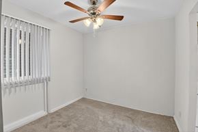 Landover apartment for rent - A dining room with a ceiling fan and carpeted floor.