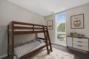 Frederick apartment for rent - A bedroom with a bunk bed and a dresser.