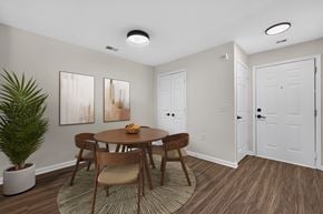 Frederick apartment for rent - A dining room with a wooden table and chairs.