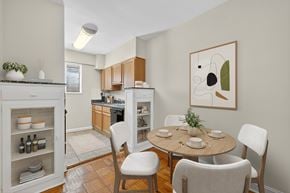 Washington apartment for rent - A kitchen with a table and chairs in front of it.