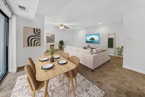 Washington apartment for rent - A modern dining room with a wooden table and chairs.
