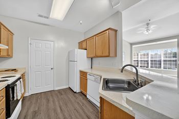 Fully-equipped kitchen with microwave, dishwasher, and breakfast bar available*