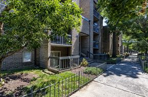Washington apartment for rent - a sidewalk in front of an apartment building