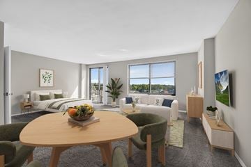 Hyattsville apartment for rent - A modern living room with a dining table and chairs.