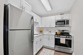 Hyattsville apartment for rent - A modern kitchen with a stainless steel refrigerator and oven.