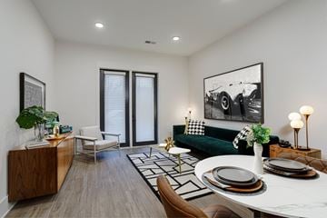 Nashville apartment for rent - A modern living room with a green couch and a coffee table.