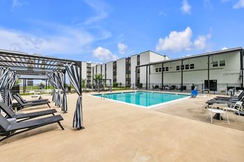 Resort-style pool with cabanas
