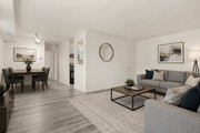 College Park apartment for rent - A living room with a grey couch and a coffee table.