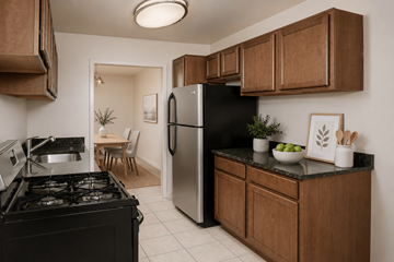 Silver Spring apartment for rent - A kitchen with a black stove and a black refrigerator.
