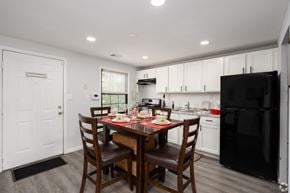 Baltimore apartment for rent - A kitchen with a table set for a meal.