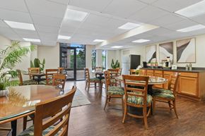Fort Washington apartment for rent - A kitchen and dining area with wooden chairs and tables.