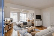 Washington apartment for rent - A bedroom with a bed, dresser, and window.