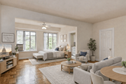 Washington apartment for rent - A living room with a television, couches, and a coffee table.