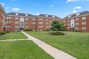 Silver Spring apartment for rent - A large brick building with a tree in the front yard.