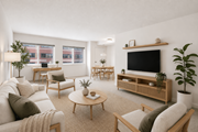 Silver Spring apartment for rent - A living room with a white couch, a wooden coffee table, and a flat-screen TV.