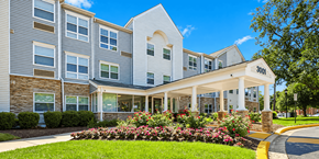 Mount Rainier apartment for rent - A large building with a white awning and the number 3001 on it.