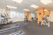 Suitland apartment for rent - gym with treadmills, weights, and exercise equipment at Ashton Heights Apartments, Maryland