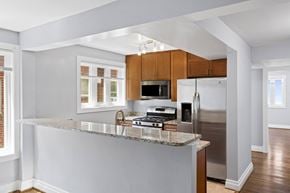 Washington apartment for rent - a kitchen with wood cabinets and a granite counter top