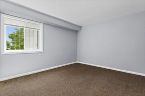 Se Washington apartment for rent - an empty room with a window and a carpet