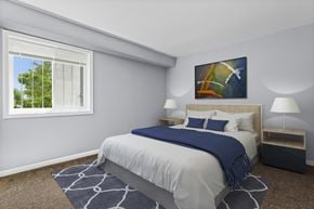 Washington apartment for rent - a bedroom with a bed and two nightstands