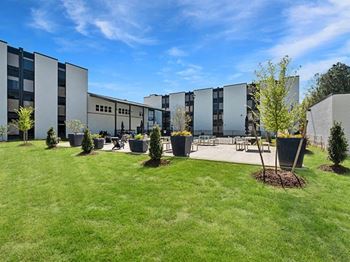 Expansive entertainment lawn with seating and gas firepit