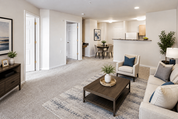 Suitland apartment for rent - A living room with a brown coffee table and a white couch.