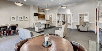 Suitland apartment for rent - a living room with a table and chairs and a kitchen