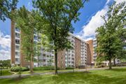 Greenbelt apartment for rent - A large apartment building with a green lawn in front at Charlestowne North Apartments, Maryland, 20770
