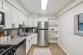 Columbia apartment for rent - White Cabinetry And Appliances In Kitchen at Aspen at Lake Trail, Columbia, MD