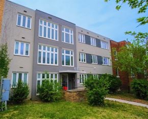 Washington apartment for rent - a large building with a sidewalk in front of it