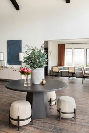 Murfreesboro apartment for rent - a dining room with a table and chairs and a vase with flowers at The Cannon, Murfreesboro, 37130