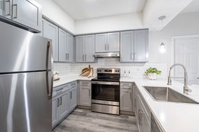 Moncks Corner apartment for rent - A modern kitchen with a stainless steel refrigerator and a double oven.