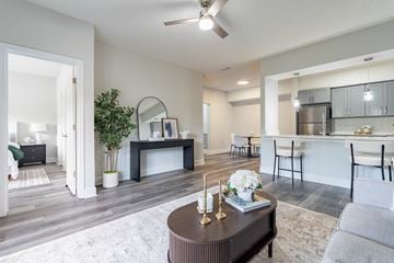 Moncks Corner apartment for rent - A modern living room with a brown coffee table in the center.