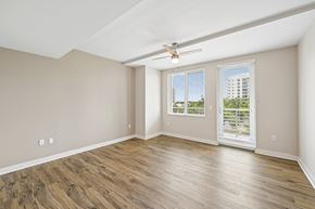 Sarasota apartment for rent - A room with wooden flooring and a ceiling fan.