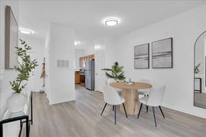 Leland apartment for rent - A modern dining room with a round table and chairs.