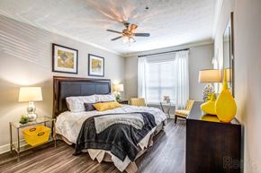 Sandy Springs apartment for rent - a bedroom with a bed and a ceiling fan  at Flats at North Springs, Sandy Springs, GA, 30328