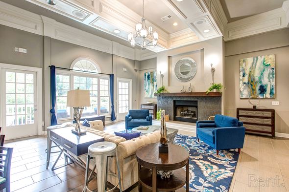 Sandy Springs apartment for rent - a living room with blue furniture and a fireplace  at Flats at North Springs, Sandy Springs, GA, 30328