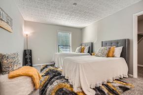 Marietta apartment for rent - A bedroom with two beds and a rug.