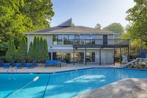 Marietta apartment for rent - A house with a pool in front of it.