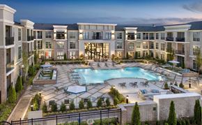 Suwanee apartment for rent - an aerial view of an apartment complex with a swimming pool