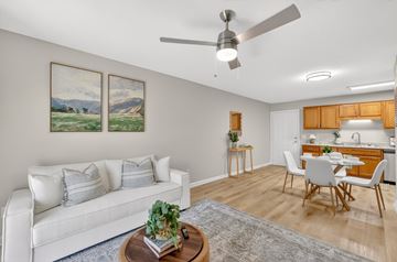 Murfreesboro apartment for rent - A living room with a white couch and a painting on the wall.