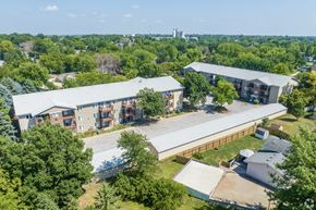 Altoona apartment for rent - A large building complex surrounded by trees.