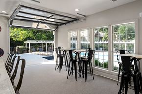 Birmingham apartment for rent - A room with a table and chairs and a pool table.
