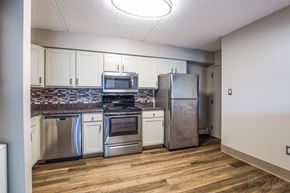 South Portland apartment for rent - Kitchen with stainless steel appliances and wooden floors at Summit Terrace, South Portland, ME