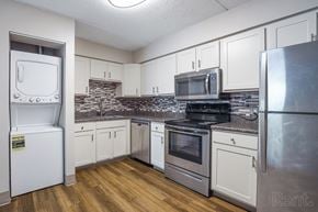 South Portland apartment for rent - Kitchen with white appliances and wooden floors at Summit Terrace, South Portland, 4106