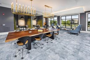 Suwanee apartment for rent - a conference room with a large wooden table and chairs