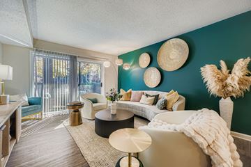 Atlanta apartment for rent - A living room with a white couch and a coffee table.
