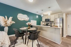 Atlanta apartment for rent - A kitchen with a dining table and chairs.